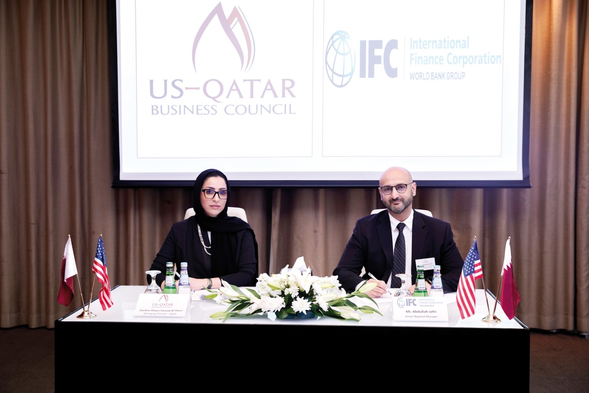 Managing Director of USQBC - Qatar, Sheikha Mayes bint Hamad Al Thani; and IFC Senior Manager for the GCC, Abdullah Jefri, during the signing ceremony.