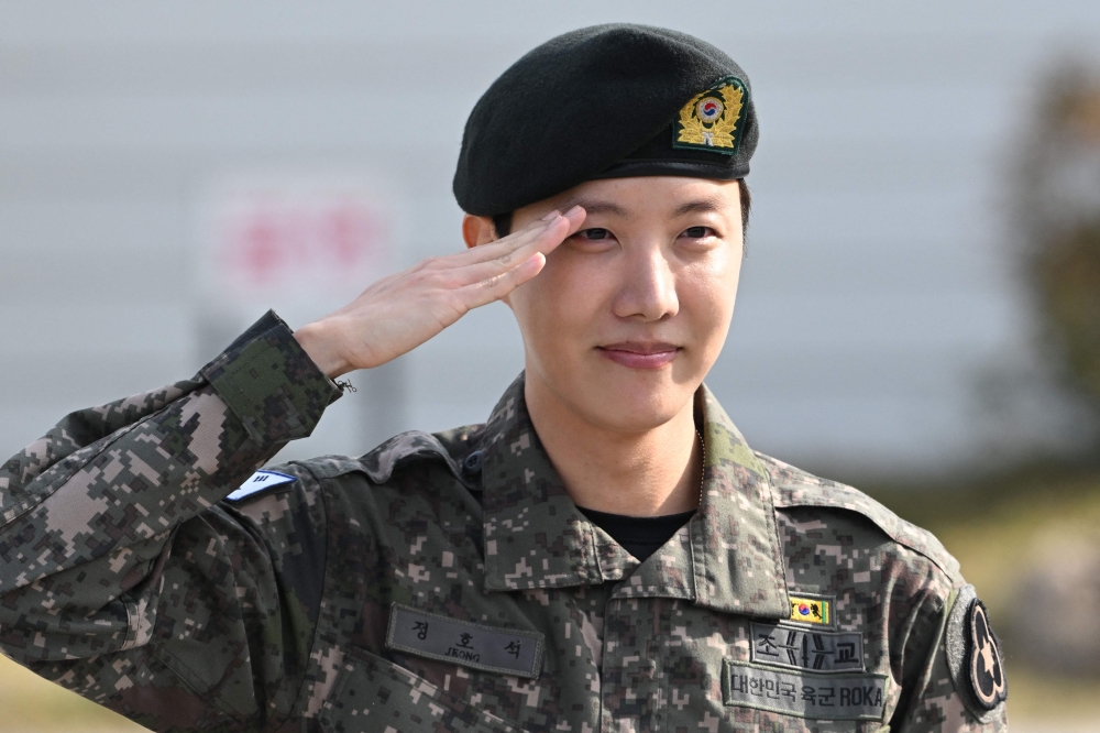 BTS member J-hope salutes after being discharged from his mandatory military service outside a military base in Wonju on October 17, 2024. Photo by JUNG YEON-JE / AFP