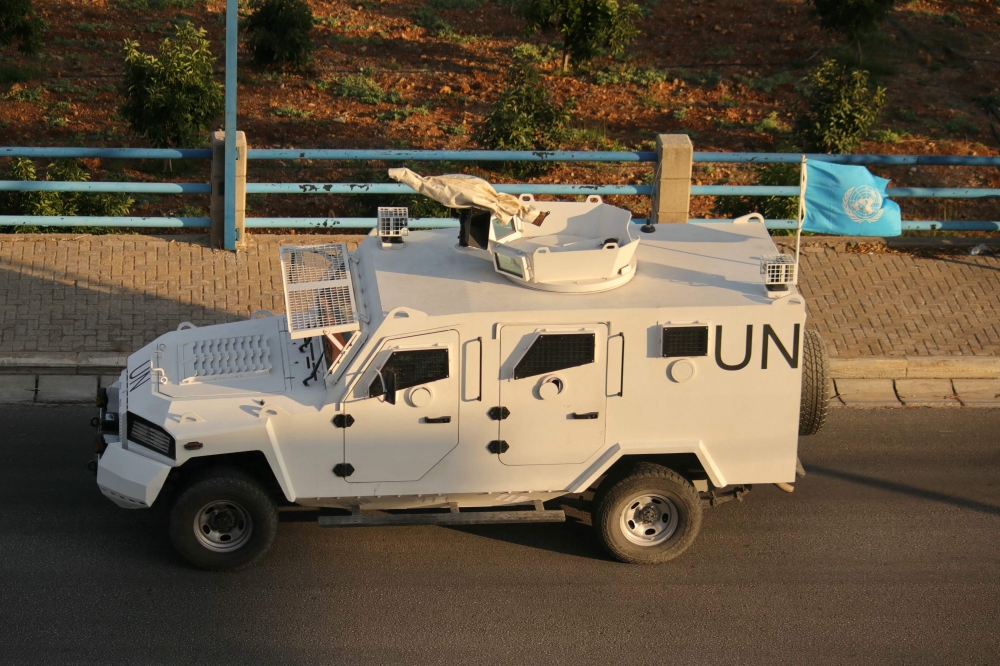 A United Nations Interim Force In Lebanon (UNIFIL) armoured vehicle drives on a road in the southern Lebanese area of Marjeyoun on October 17, 2024. UNIFIL, a mission of about 9,500 troops of various nationalities, was created following Israel's 1978 invasion of Lebanon. (Photo by AFP)