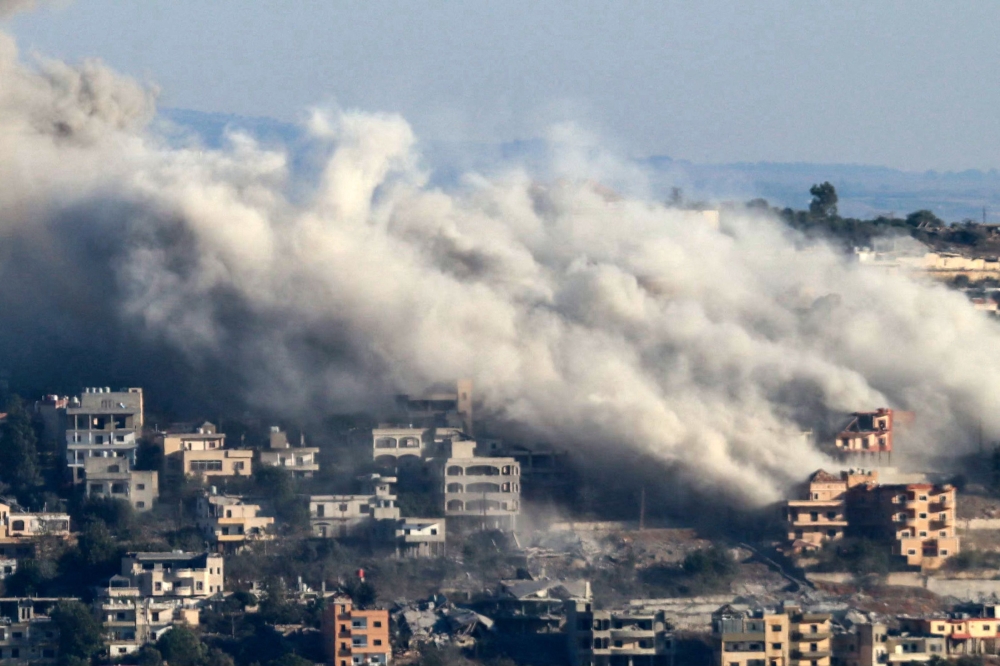 Smoke rises from the site of an Israeli airstrike that targeted the southern Lebanese border village of Khiam on October 20, 2024. (Photo by AFP)

