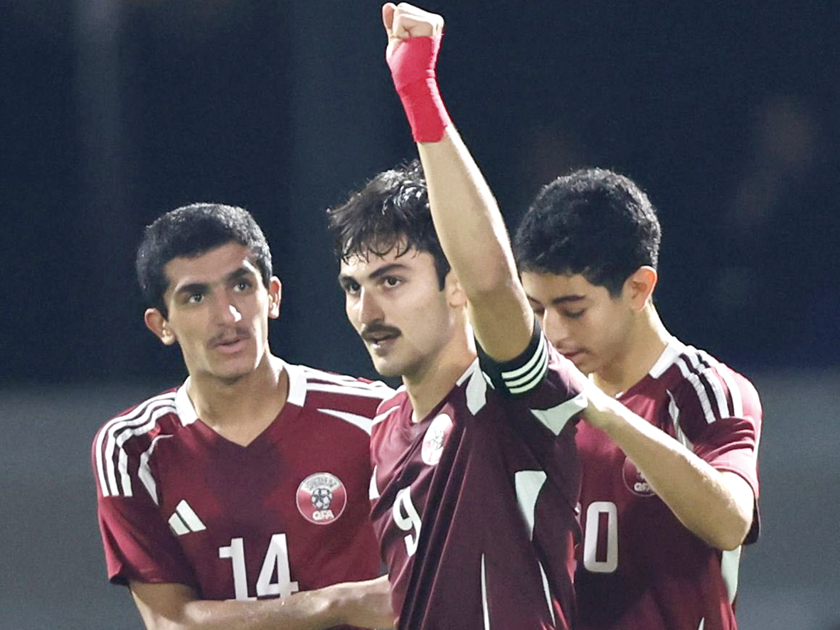 Qatar's Zaid Faisal (centre) celebrates with teammates after scoring a goal against Mongolia, yesterday.