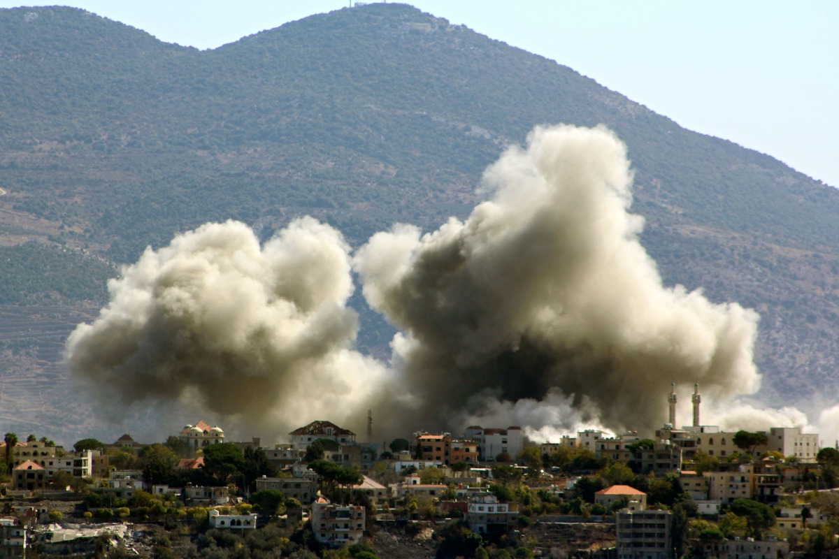 Smoke rises from the site of an Israeli airstrike that targeted the southern Lebanese village of Khiam on October 24, 2024. (Photo by AFP)
