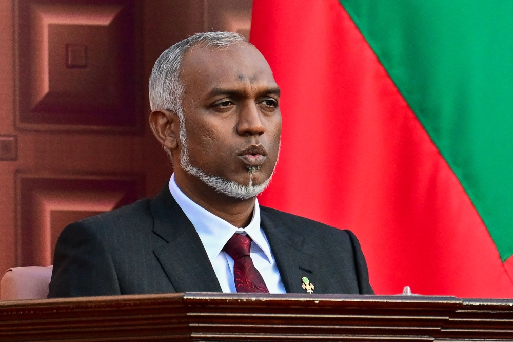 Maldives' President Mohamed Muizzu looks on after reading the oath during his inauguration ceremony in Male on November 17, 2023. (Photo by Ishara S. Kodokara / AFP)