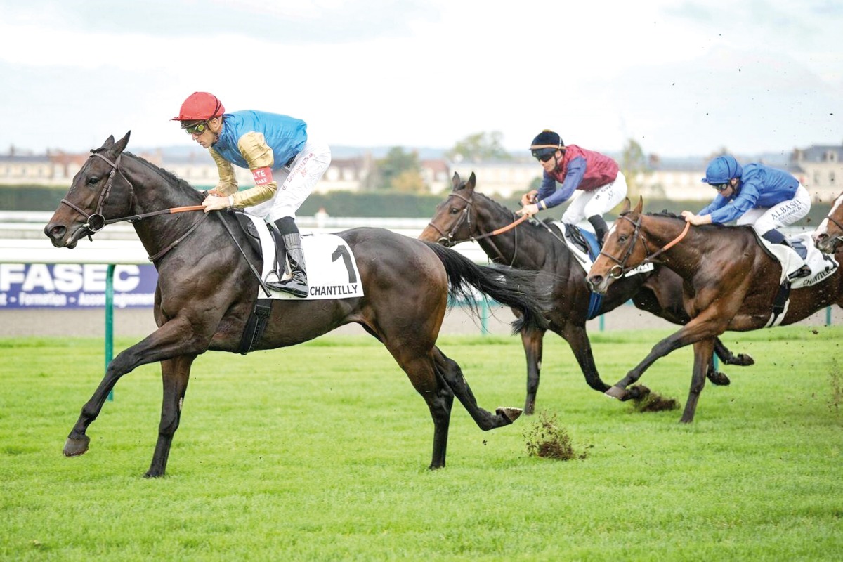 Christophe Soumillon steers Map Of Stars (left) towards the title at Chantilly yesterday.  