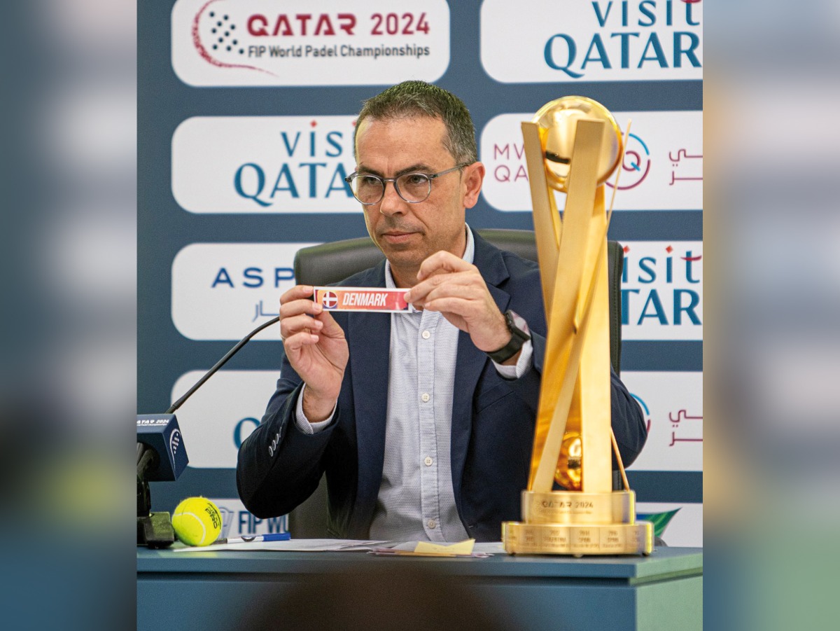 An official picks Denmark during the draw ceremony in Doha, yesterday.