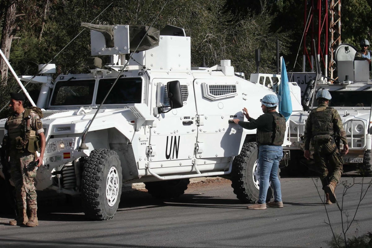 Lebanese army soldiers and members of the United Nations Interim Force in Lebanon (UNIFIL) patrol near the southern Lebanese village of Marjayoun on October 29, 2024. (Photo by Rabih DAHER / AFP)
