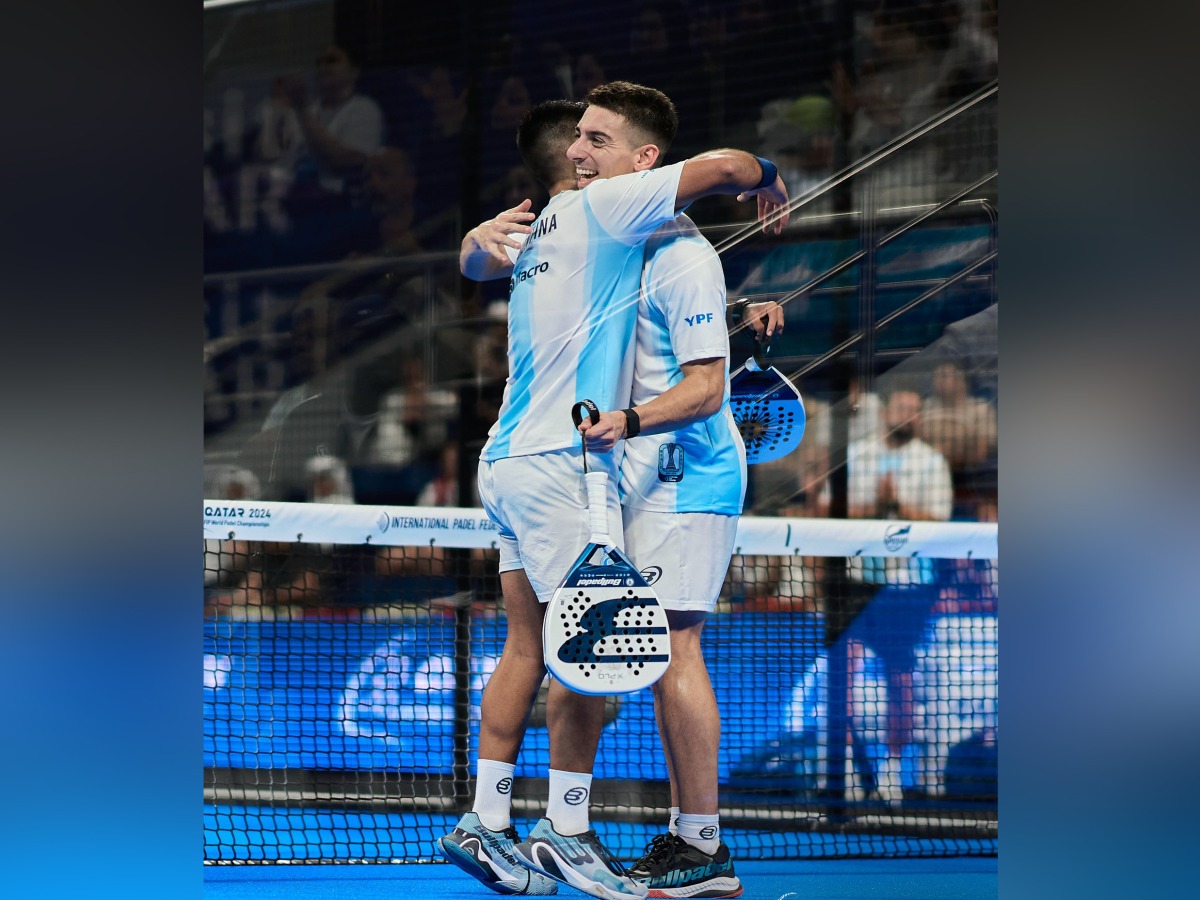 Argentina players celebrate after winning a match against Chile.