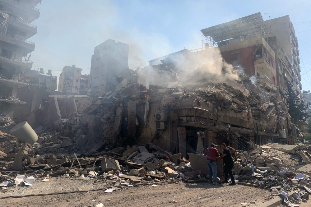 People check the devastation in the aftermath of Israeli strikes in the neighbourhood of Haret Hreik in Beirut's southern suburbs on November 1, 2024. (Photo by AFP)
 