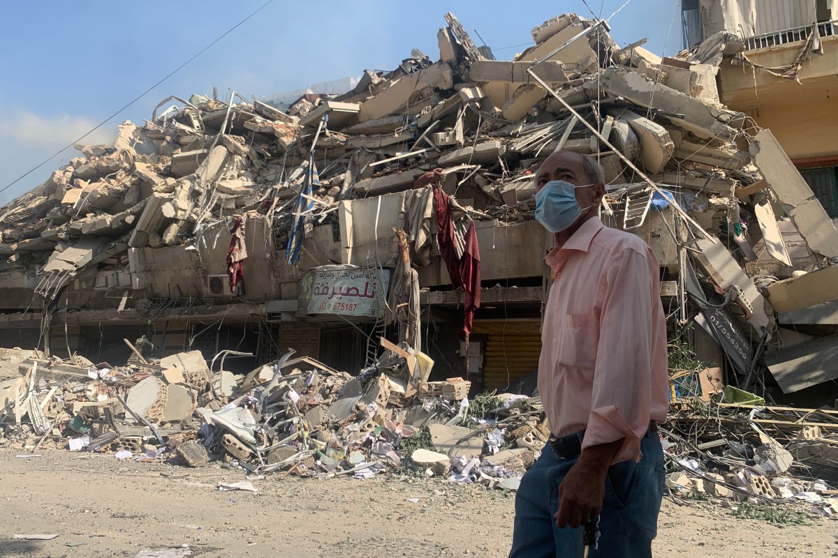 A man walks past a destroyed building in the aftermath of Israeli strikes in the neighbourhood of Haret Hreik in Beirut's southern suburbs on November 1, 2024. Photo by AFP.