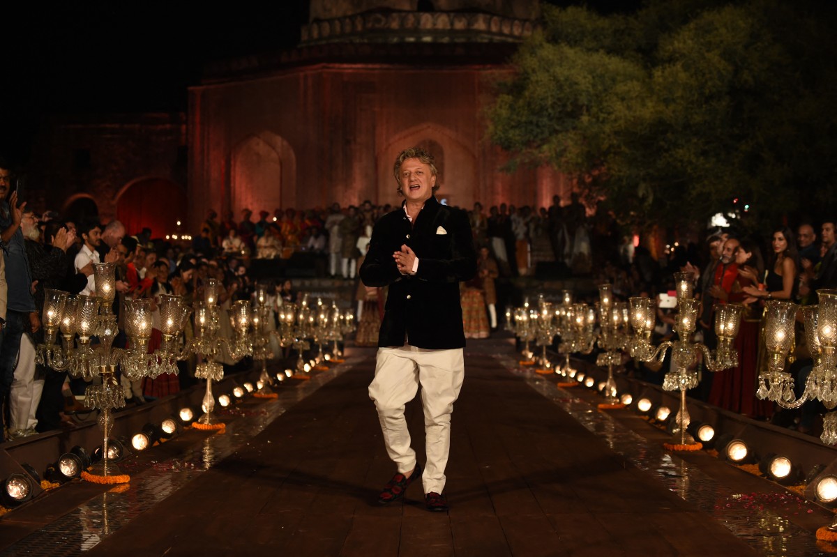 Archival photo used for demonstration purposes. Indian designer Rohit Bal walks on the catwalk during the Grand Finale of the Wills Lifestyle Indian Fashion Week Spring/Summer 2015 Collection in New Delhi on October 12, 2014. Photo by Sajjad HUSSAIN / AFP.