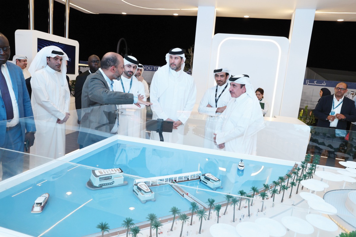 Minister of Transport H E Jassim Saif Ahmed Al Sulaiti (first right) being briefed about the Water Taxi project, during his visit to Qatar Boat Show.