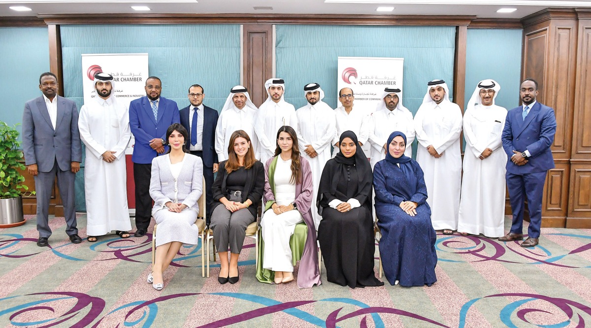 Officials pose for a photo during the training program.