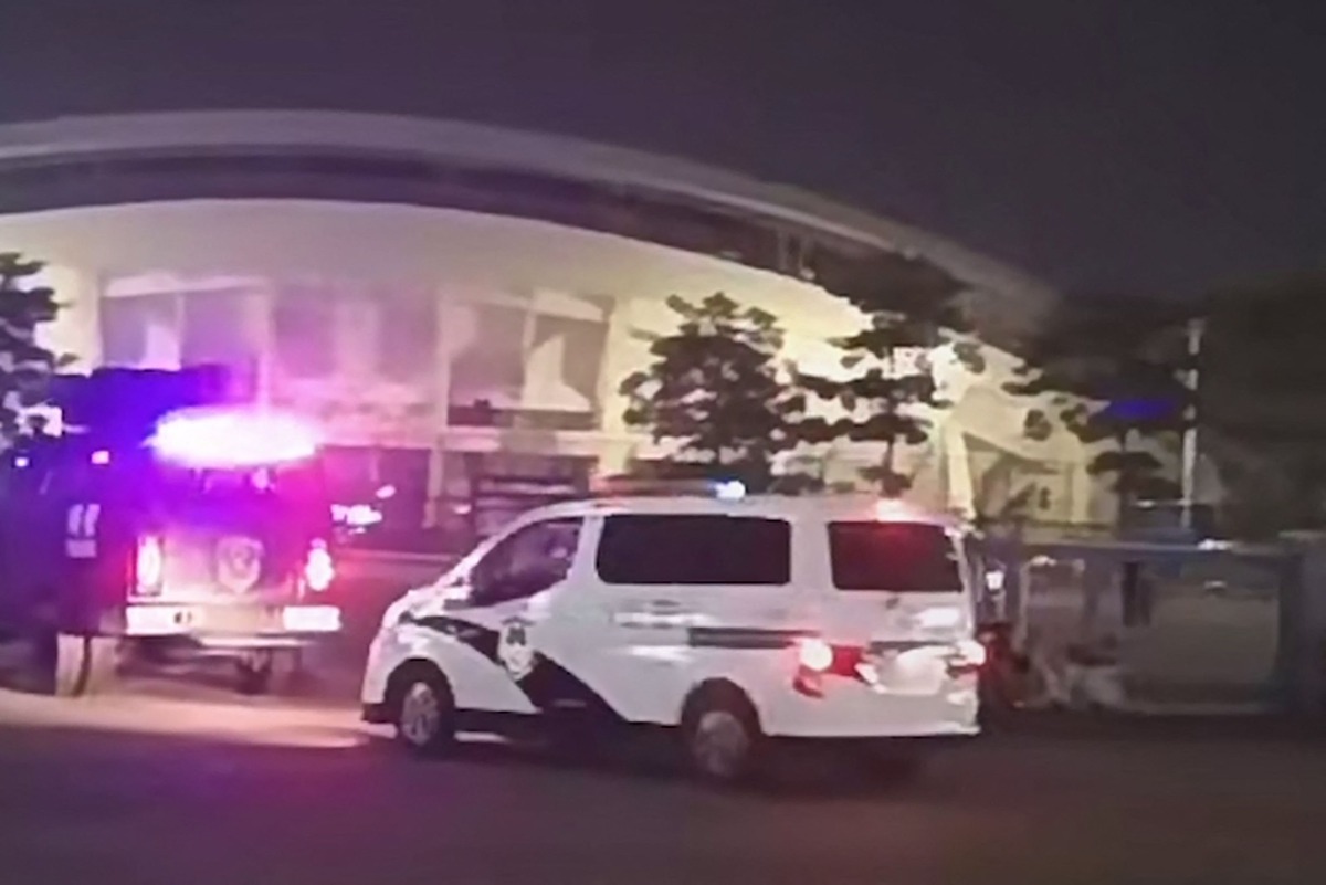 This image grab from a UGC video posted on November 11, 2024 shows emergency vehicles arriving after a driver ploughed through a crowd of people exercising at a sports center in Zhuhai, in south China's Guangdong province. Photo by UGC / AFP