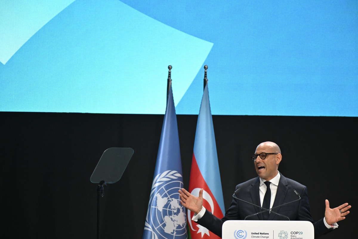 UN climate chief Simon Stiell delivers a speech during the opening of the 2024 United Nations Climate Change Conference (COP29) in Baku on November 11, 2024. (Photo by Alexander Nemenov / AFP)