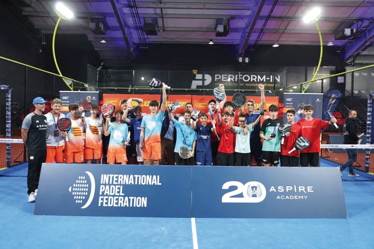 Players celebrate with their trophies.