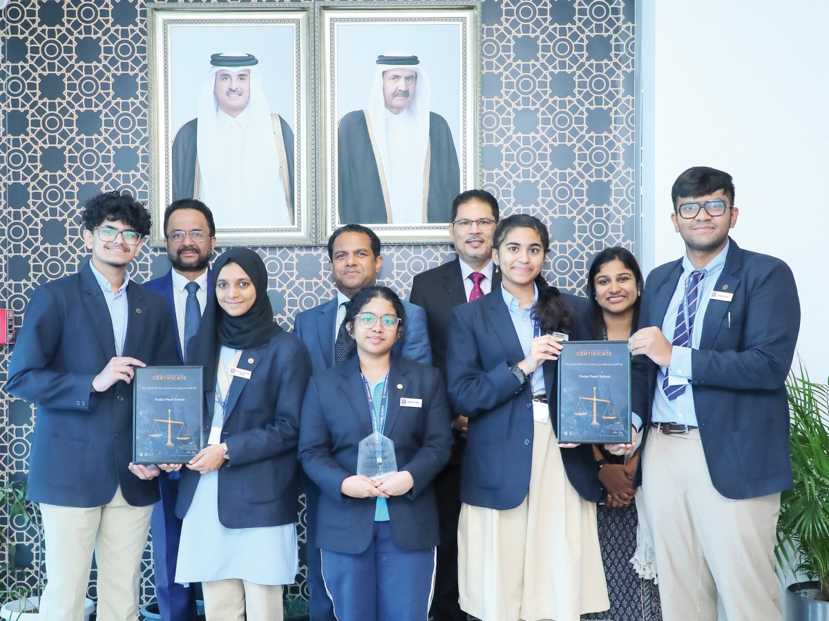 Students and school officials with the award.