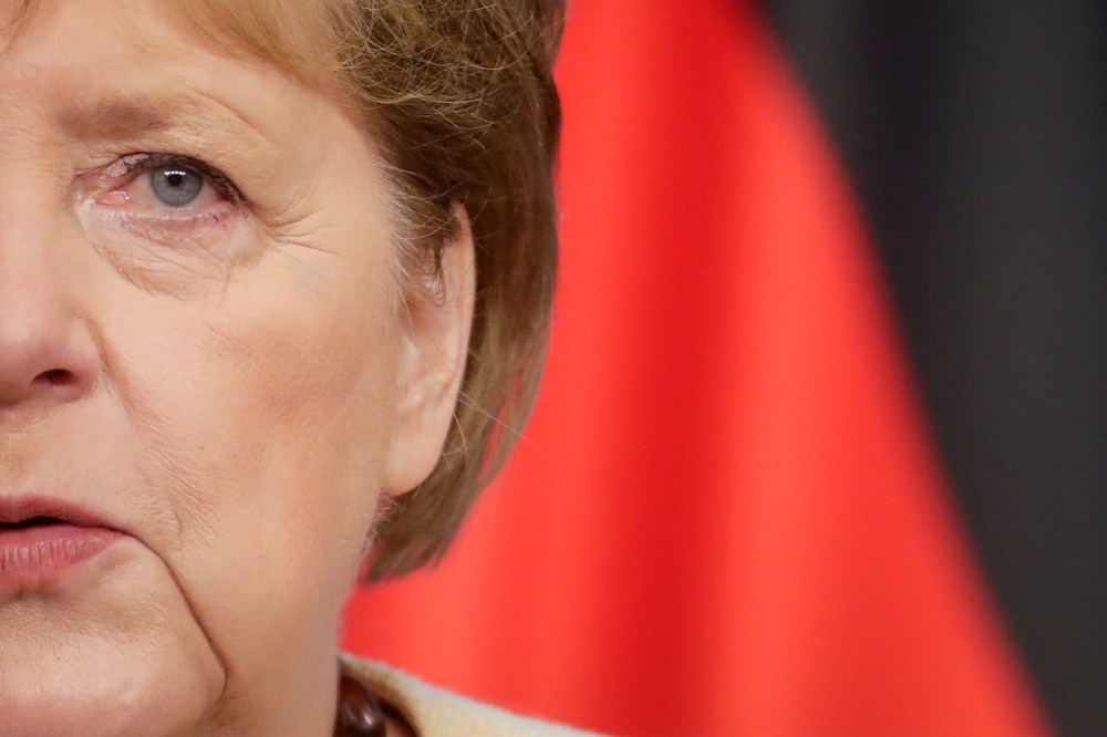 (Files) In this file photo taken on June 15, 2021, then German Chancellor Angela Merkel gives a press conference at the end of the second day of an EU summit at the European Council building in Brussels. (Photo by Stephanie Lecocq / Pool / AFP)