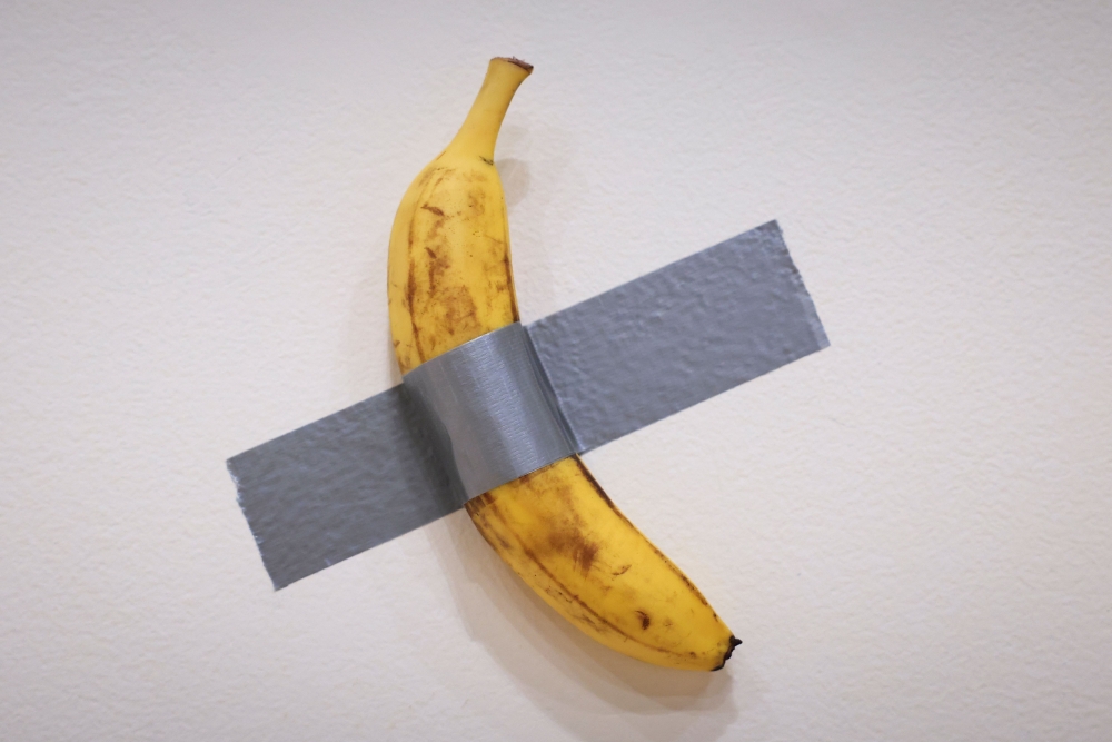 File: Italian visual artist Maurizio Cattelan's duct-taped banana entitled 