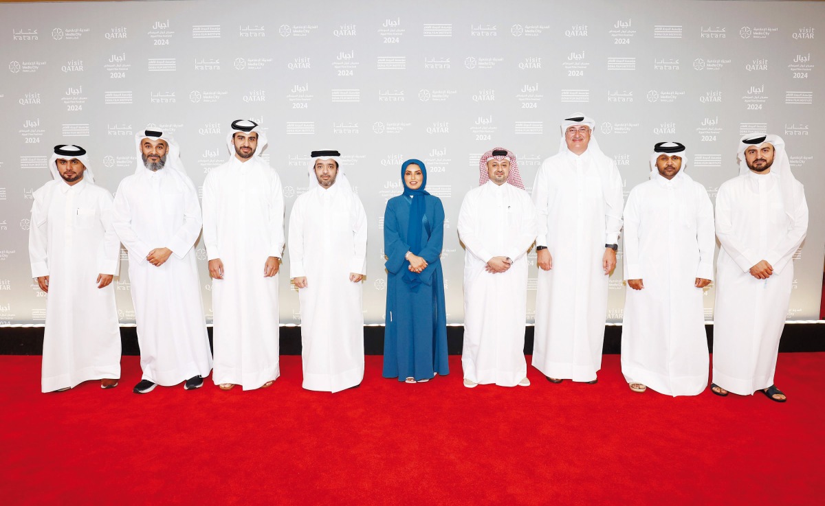 Chairman of Qatar Tourism Saad bin Ali Al Kharji (fourth left); CEO of DFI Fatma Hassan Alremaihi (centre); and other officials at the festival. 