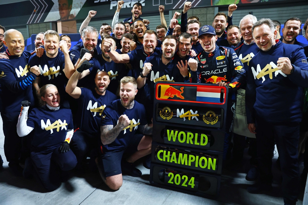 2024 F1 World Drivers Champion Max Verstappen of the Netherlands and Oracle Red Bull Racing celebrates with his team on November 23, 2024 in Las Vegas, Nevada. Mark Thompson/Getty Images/AFP 