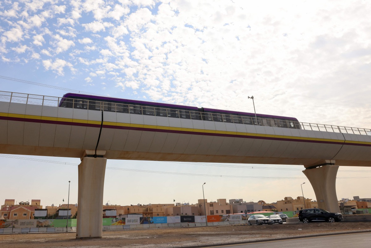 A metro train is tested on the line leading to the King Abdullah Financial District station in the Saudi capital Riyadh on November 26, 2024. (Photo by Fayez Nureldine / AFP)
