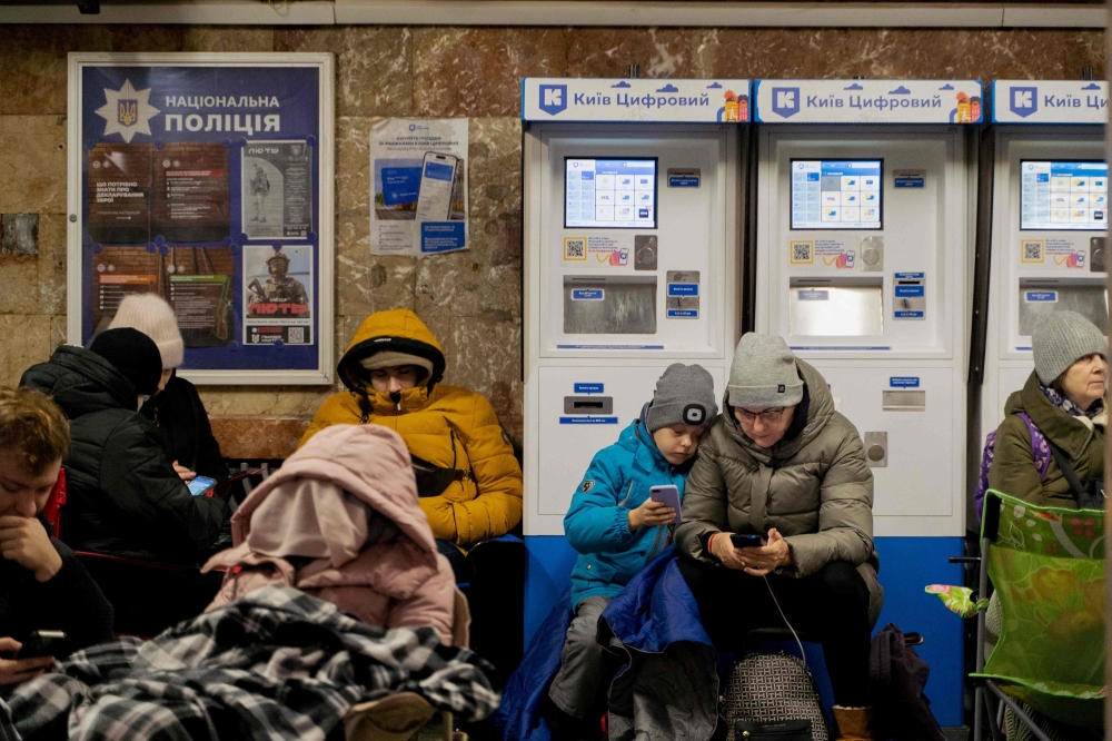 Local residents take shelter in a metro station during an air strike alarm in Kyiv, on November 28, 2024, amid the Russian invasion of Ukraine. (Photo by Tetiana Dzhafarova / AFP)
