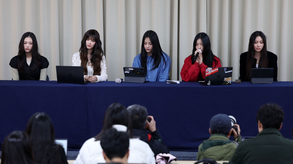 South Korean K-pop girl group NewJeans members (L-R) Haerin, Danielle, Minji, Hanni and Hyein attend a press conference in Seoul on November 28, 2024. Photo by YONHAP / AFP