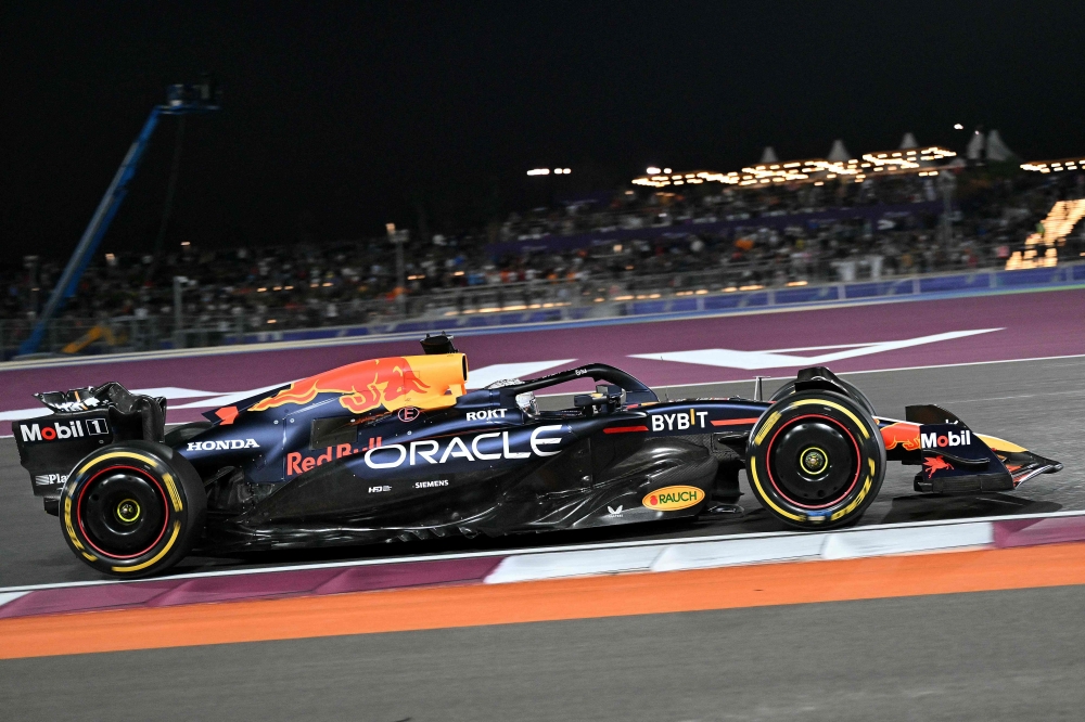 Red Bull Racing's Dutch driver Max Verstappen drives during the sprint race ahead of the Qatari Formula One Grand Prix at the Lusail International Circuit in Lusail, north of Doha, on November 30, 2024. (Photo by Andrej ISAKOVIC / AFP)