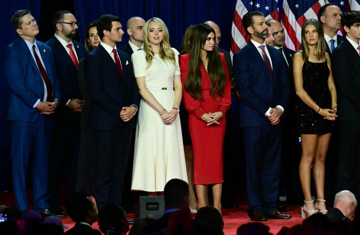 Tiffany Trump and her husband Michael Boulos, Kimberly Guilfoyle, her partner Donald Trump Jr. and his his daughter Kai Madison Trump listen to former US President and Republican presidential candidate Donald Trump speak an election night event at the West Palm Beach Convention Center in West Palm Beach, Florida, early on November 6, 2024. (Photo by Jim WATSON / AFP)