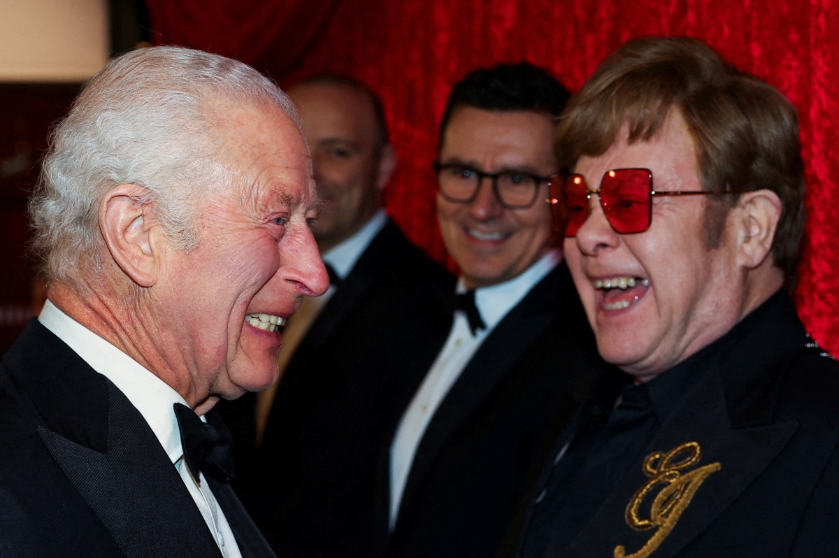 Britain's King Charles III reacts as he meets Elton John as he attends the Royal Variety Performance at the Royal Albert Hall in London on November 22, 2024. (Photo by Toby Melville / POOL / AFP)