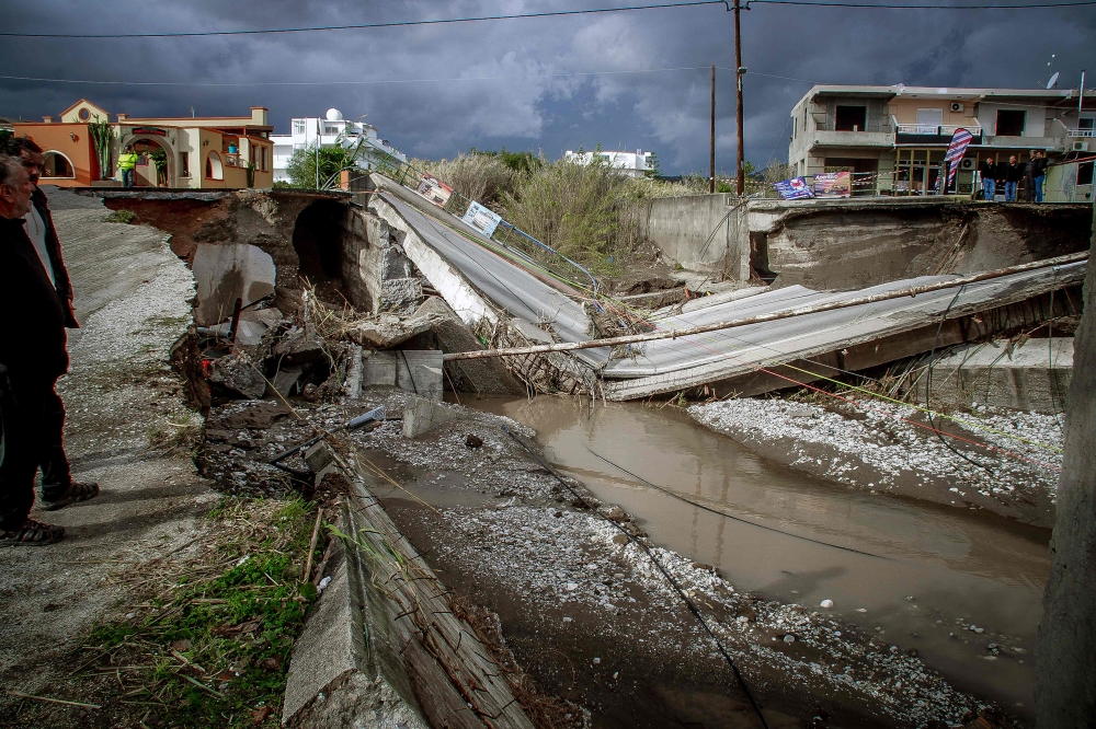 This photograph shows a collapsed bridge in Rhodes island after heavy rainfall, on Decembber 1, 2024. (Photo by Stringer / Eurokinissi / AFP)