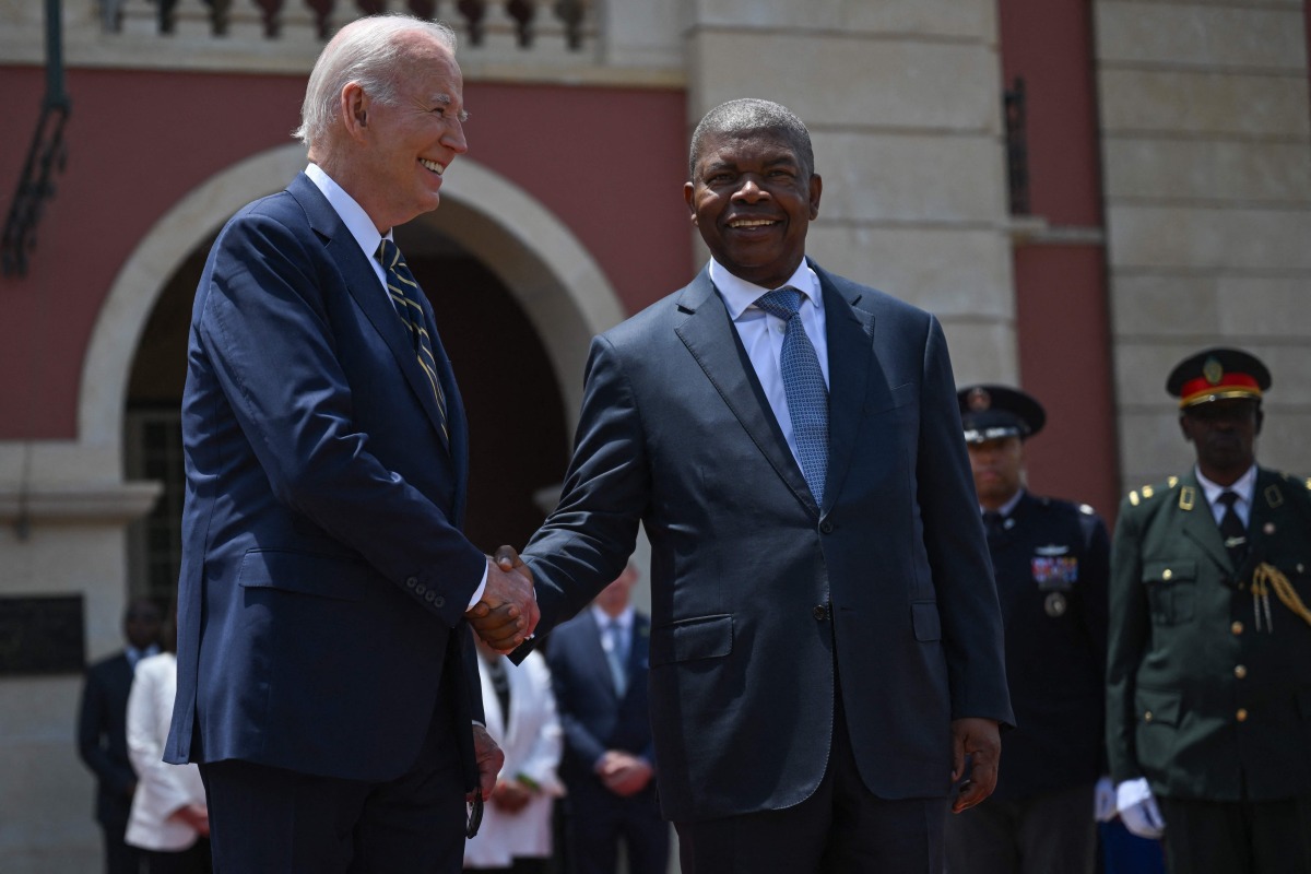 US President Joe Biden (L) shakes hands with Angola President Joao Lourenco (R) ahead of their bilateral meeting at the Presidential Palace in Luanda on December 3, 2024. (Photo by ANDREW CABALLERO-REYNOLDS / AFP)
