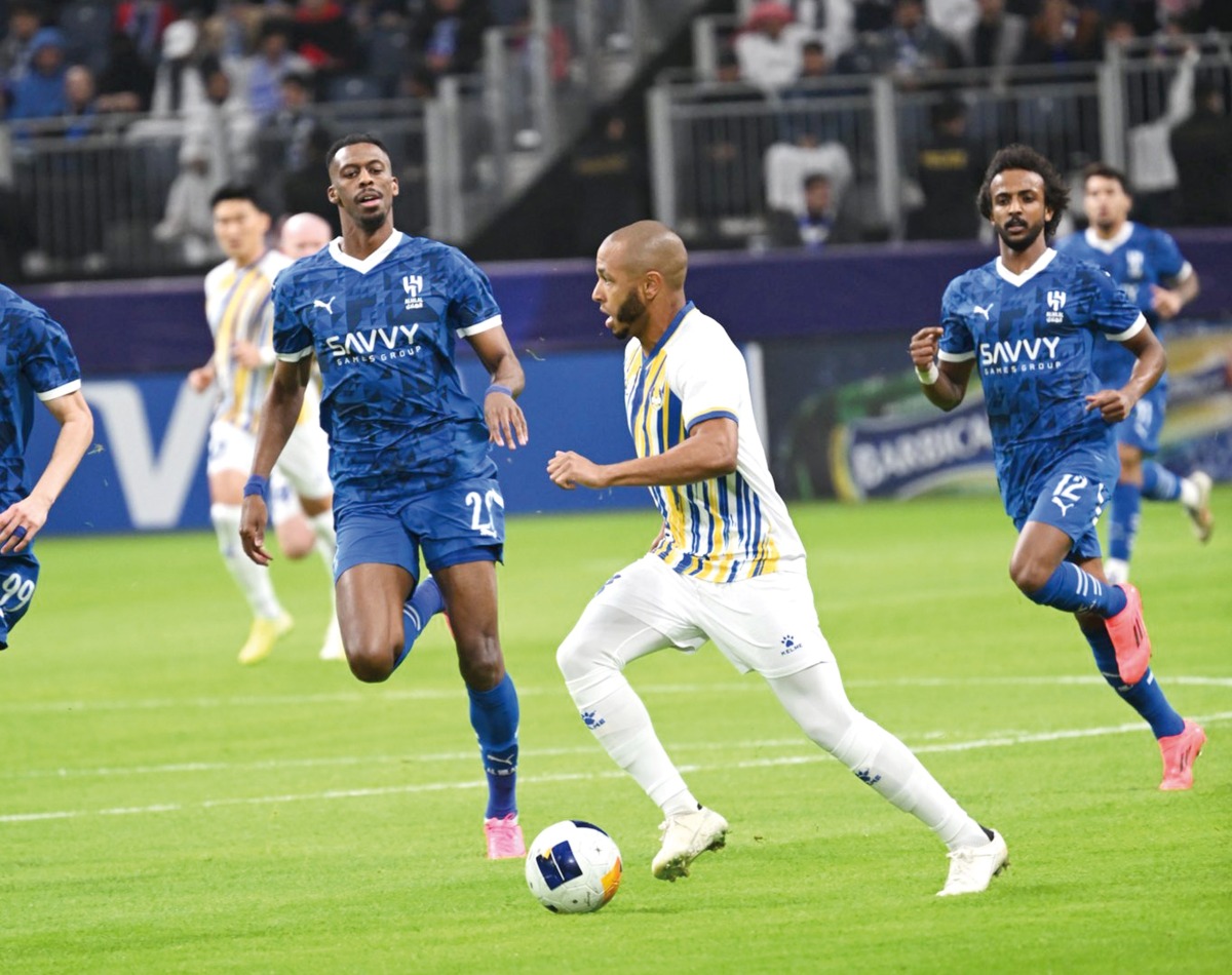 Al Gharafa's Yacine Brahimi (centre) in action during the match against Al Hilal SFC in Riyadh yesterday.