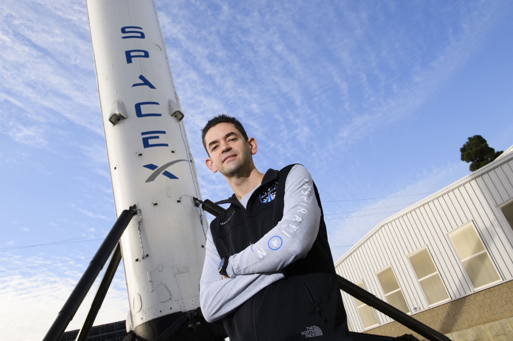 Inspiration4 mission commander Jared Isaacman, founder and chief executive officer of Shift4 Payments, stands for a portrait in front of the recovered first stage of a Falcon 9 rocket at Space Exploration Technologies Corp. (SpaceX) on February 2, 2021 in Hawthorne, California. (Photo by Patrick T. Fallon / AFP)