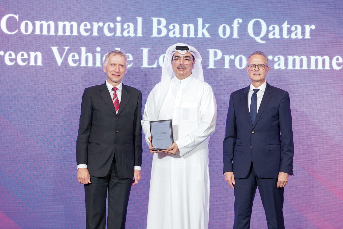 A Commercial Bank official receiving the award at the event.