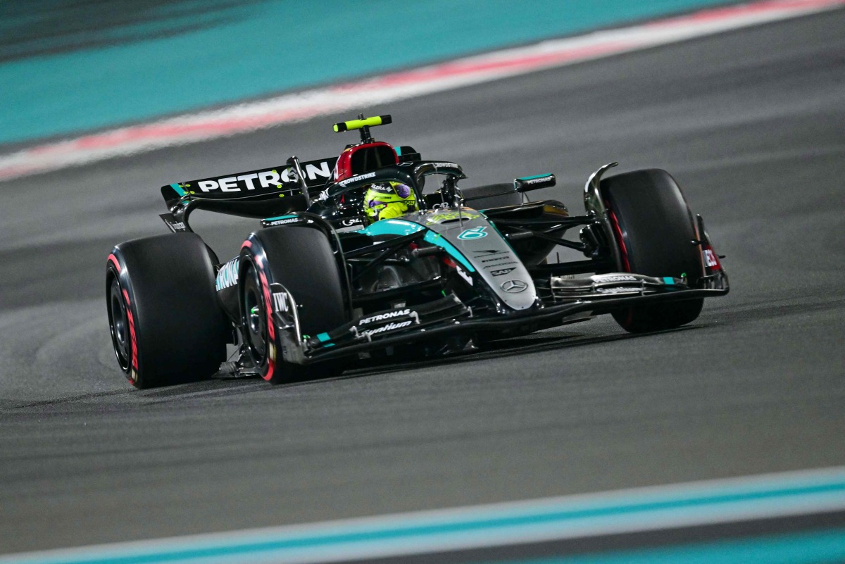 Mercedes' British driver Lewis Hamilton drives during the qualifying session ahead of the Abu Dhabi Formula One Grand Prix at the Yas Marina Circuit in Abu Dhabi on December 7, 2024. (Photo by Giuseppe CACACE / AFP)
