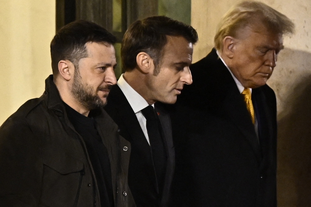 (From left) Ukraine's President Volodymyr Zelensky, France's President Emmanuel Macron, and US president-elect Donald Trump after a meeting at the Elysee Presidential Palace in Paris on December 7, 2024. (Photo by Julien De Rosa / AFP)