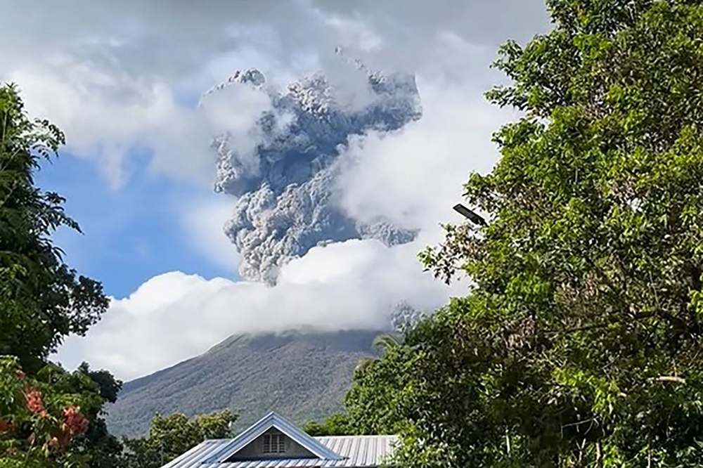 This frame grab from video footage taken on December 9, 2024 and posted on the Facebook account of Dianne Paula Abendan shows the eruption of Kanlaon volcano as seen from Biak na Bato village in La Castellana town in Negros Occidental province, central Philippines. (Photo by Dianne Paula Abendan / various sources / AFP)