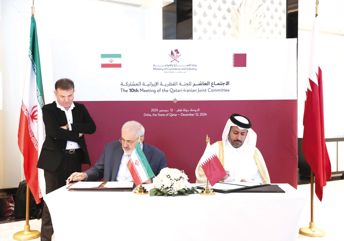 Minister of Commerce and Industry, H E Sheikh Faisal bin Thani bin Faisal Al Thani, and Minister of Energy of the Islamic Republic of Iran, H E Dr. Abbas Aliabadi, during the signing ceremony.