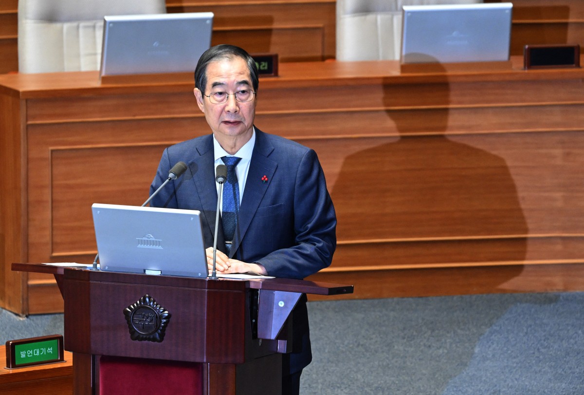 South Korean Prime Minister Han Duck-soo attends a plenary session, where a question-and-answer session was held relating to the martial law declaration, at the National Assembly in Seoul on December 11, 2024. Photo by JUNG YEON-JE / AFP.