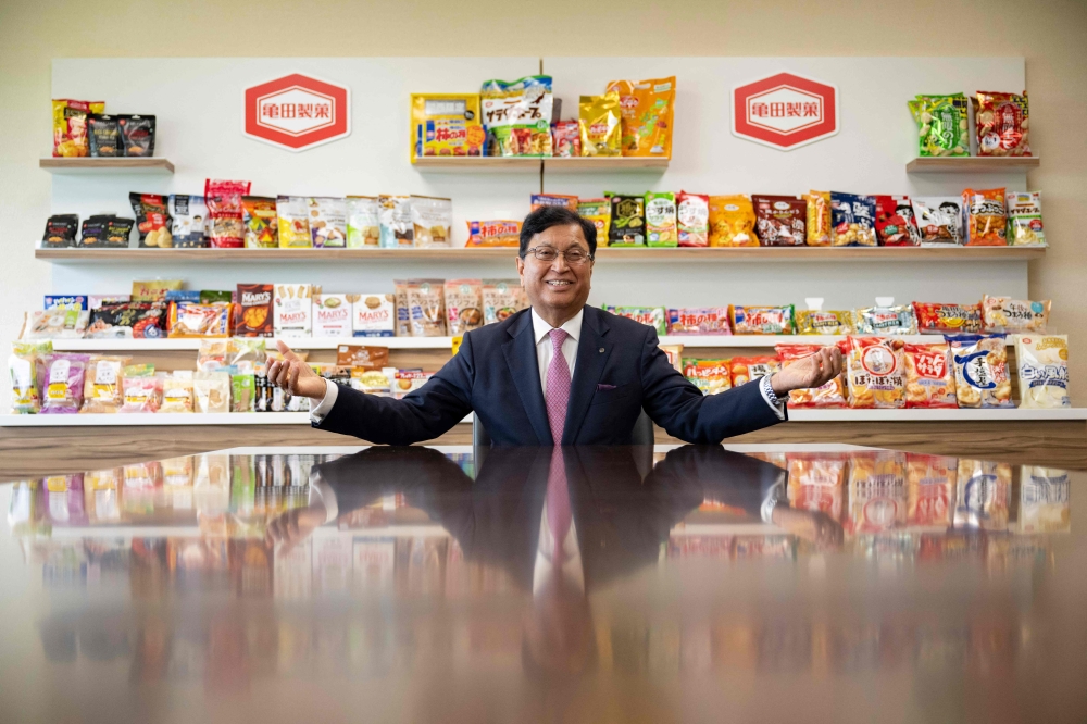 This picture taken on August 5, 2024 shows Lekh Juneja, chairman and CEO of Kameda Seika, posing for photos at the company's headquarters in Niigata city, Niigata prefecture. (Photo by Yuichi Yamazaki / AFP)