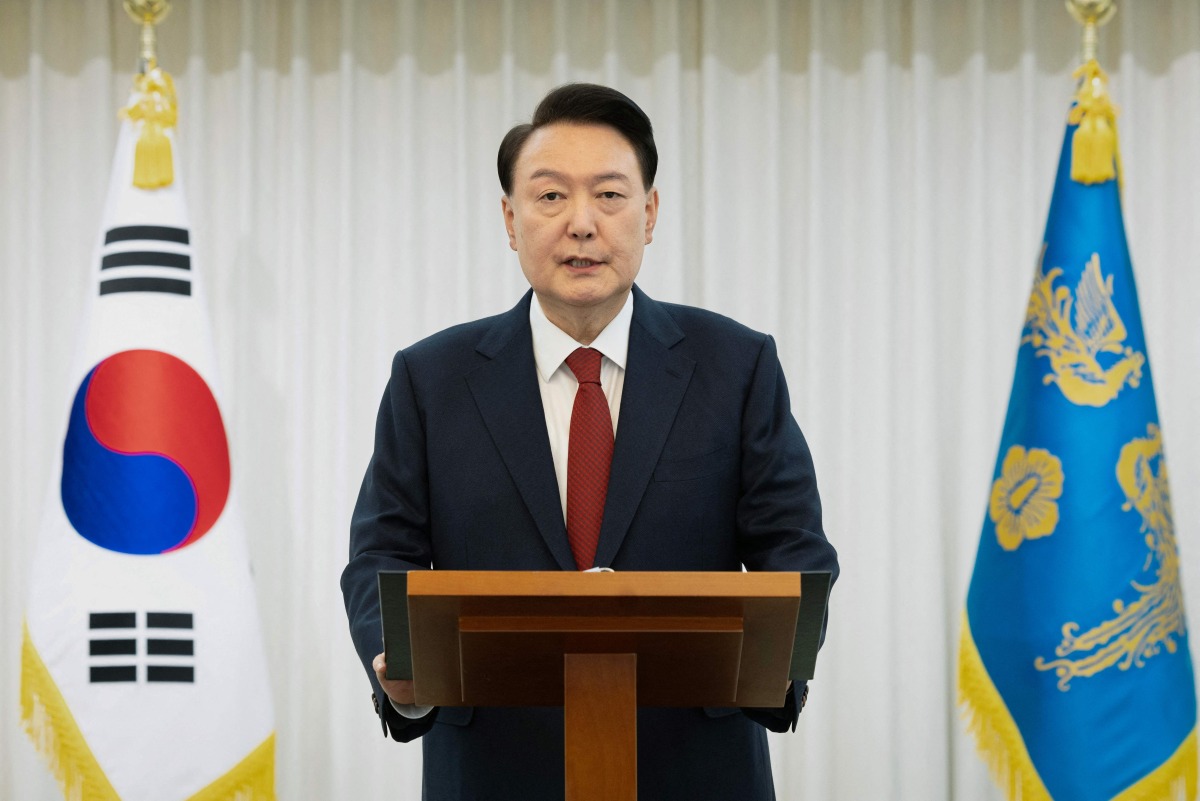 This handout photo taken on December 14, 2024 and released by the South Korean Presidential Office shows President Yoon Suk Yeol giving a public address from his official residence in Seoul. Photo by Handout / South Korean Presidential Office / AFP