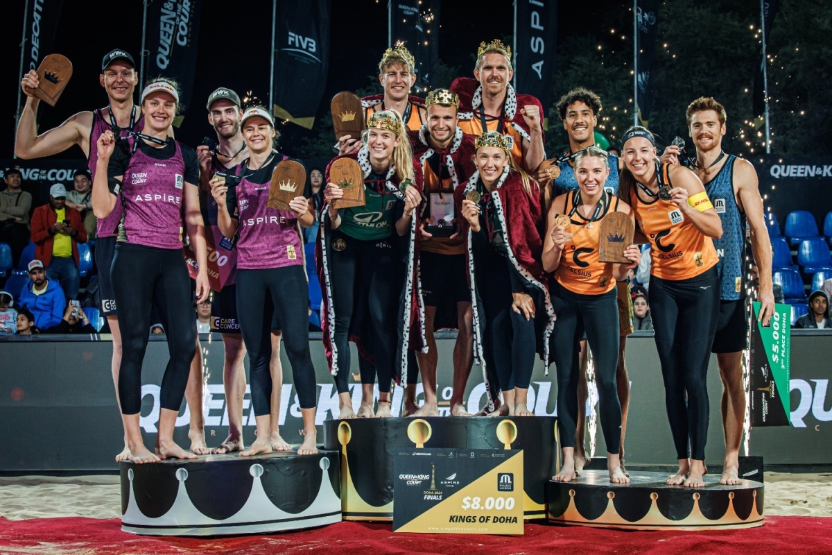 The podium winners of the Queen & King of the Court Beach Volleyball Finals Doha 2024 celebrate on the podium.