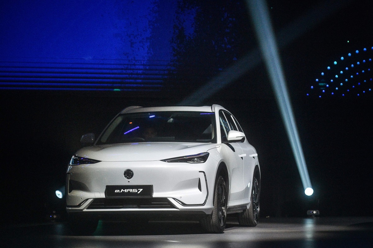 Malaysia first locally produced electric vehicle (EV), the e.MAS 7, is seen during its launch event at Malaysia International Trade and Exhibition Centre (MITEC) in Kuala Lumpur on December 16, 2024. (Photo by ARIF KARTONO / AFP)
