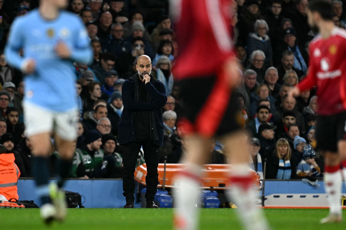 Manchester City's Spanish manager Pep Guardiola watches the players from the touchline during the English Premier League football match between Manchester City and Manchester United at the Etihad Stadium in Manchester, north west England, on December 15, 2024. (Photo by Paul ELLIS / AFP)