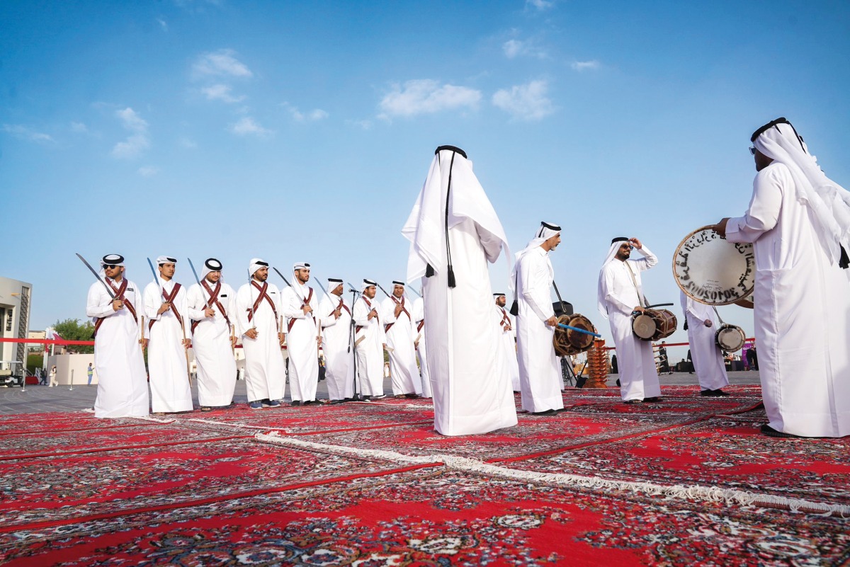 A troupe performs on traditional songs as part of Qatar National Day celebrations, at Katara Cultural Village.