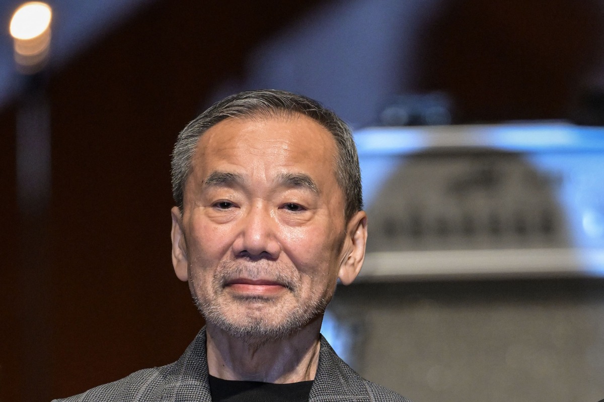 This picture taken on June 29, 2024 shows Japanese author Haruki Murakami posing during a photo call following a performance entitled the “Haruki Murakami produce Murakami JAM vol.3 – A hot and gentle fusion night”, at the Sumida Triphony Hall in Tokyo. Photo by Richard A. Brooks / AFP