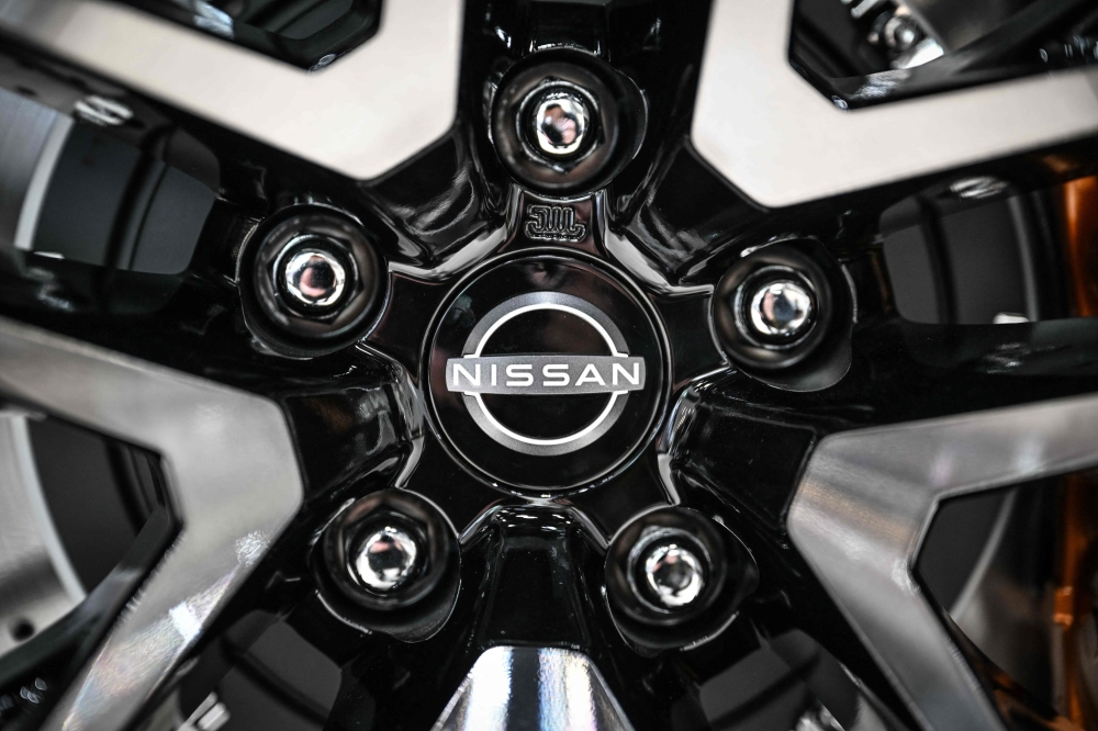 (Files) The emblem of Japanese automaker Nissan Motor is seen at a showroom in Yokohama on May 9, 2024.(Photo by Yuichi Yamazaki / AFP)
 