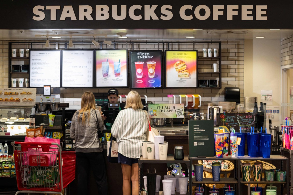 Customers order at a Starbucks in Manhattan Beach, California, on July 19, 2024. Photo by ETIENNE LAURENT / AFP