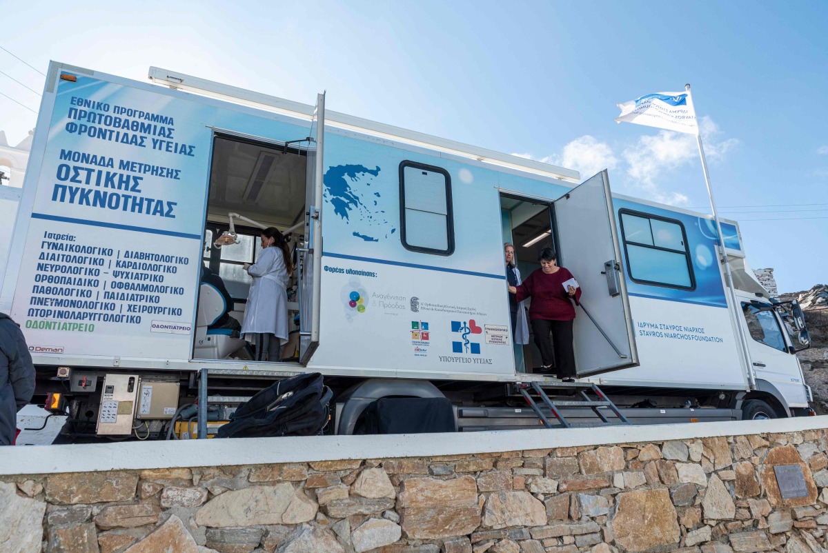 Doctors examine patients aboard a truck used as a mobile clinic set up by Stavros Niarchos mobile medical unit on Sikinos Island, on December 14, 2024. Photo by Spyros BAKALIS / AFP